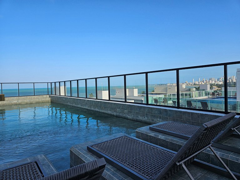 Lindo Flat com 2 camas casal a 50m da praia