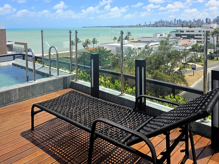 Belo flat 50m da praia no Bessa