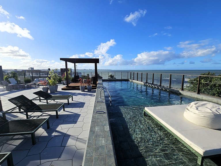 Belo Flat "pé na areia" no Jardim Oceania